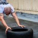 bald man doing workout