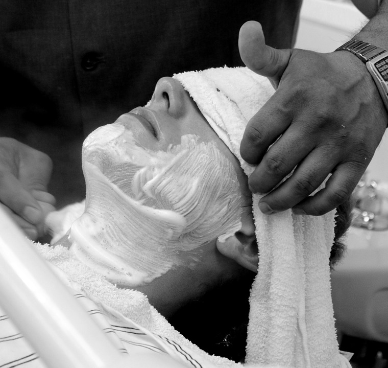 man getting facial hair removal
