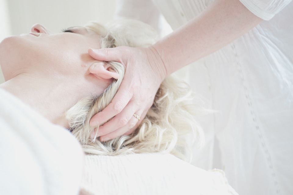 blond girl getting head massage